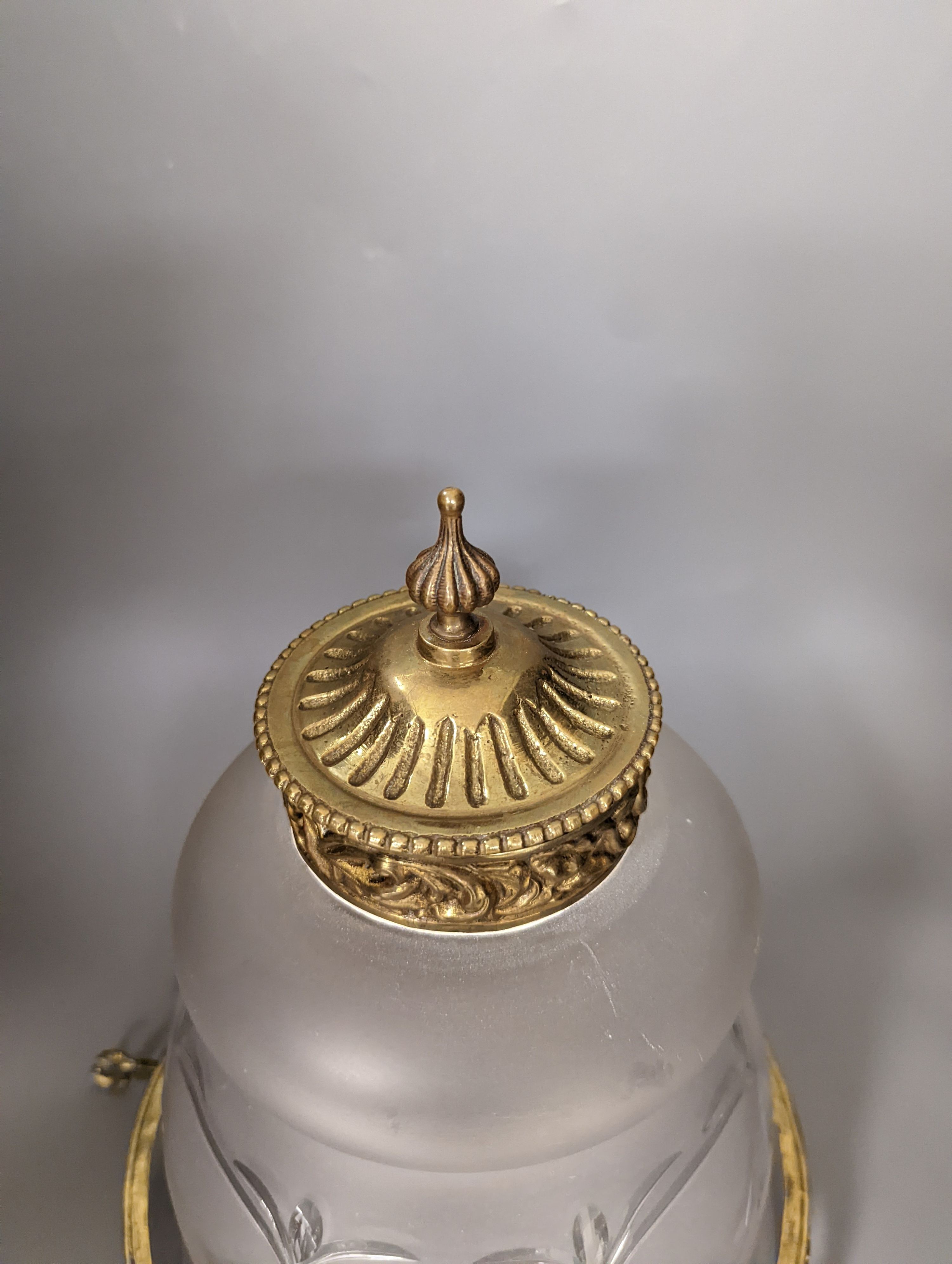 An overlaid etched glass and brass hanging light, 36 cms high, not including chain.